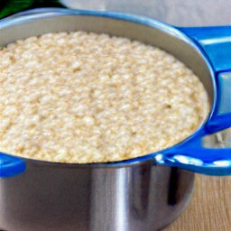 a bowl of oatmeal with apple juice, salt, ground cinnamon, and nutmeg.