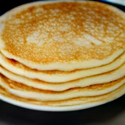 the cooked pancakes are transferred to a plate.