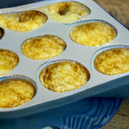 a savory muffin tin dish with potatoes, garlic, salt, black pepper, sour cream, gouda cheese, butter and nutmeg.