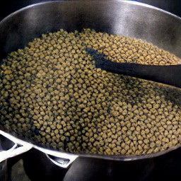 a pot of onion-rice that has been cooked with water, cumin, cayenne pepper, salt, black pepper, and lemon juice.