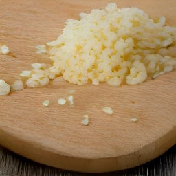 a peeled and minced garlic clove.