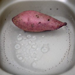 the sweet potato is rinsed and then patted dry.