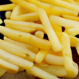 cut potatoes into fries.