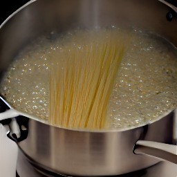 adding salt and spaghetti to the boiling water.