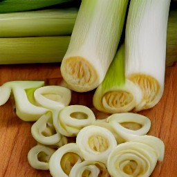 baby leeks that are trimmed and sliced, as well as chopped spearmint, parsley, and chives.