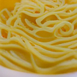 the egg noodles are drizzled with olive oil.