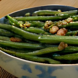 the dish is served on a plate with the parsley mixture scattered on top.