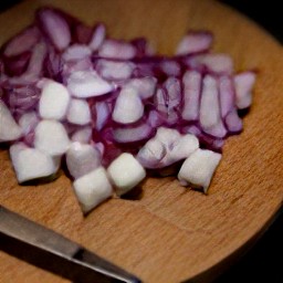 a peeled and diced avocado, and red onions.