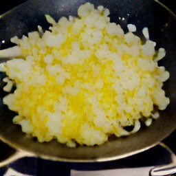a sautéed mixture of unsalted butter, yellow onions, all purpose flour, ground nutmegs, whipping cream and whole milk.