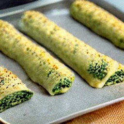 the pastry rolls are brushed with an egg wash mixture.