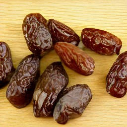 removing the pits from the dates.