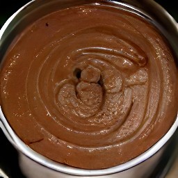 the output is a dough made from dates, walnuts, cocoa powder and vanilla extract.