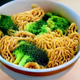 a bowl of pasta with spicy peanut sauce, broccoli, and cucumber.