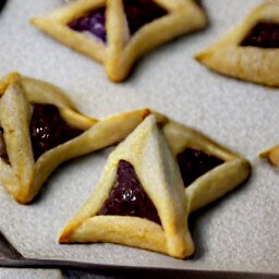 the baked hamentashen dough is transferred to a serving plate.