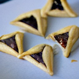 the cookie sheet should have a baked hamentashen dough after being in the oven for 15 minutes.