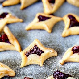 the cookie sheet will have hamentashen dough on it that is sprinkled with a quarter cup of granulated sugar.