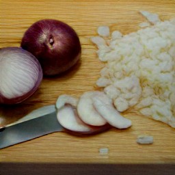 a savoy cabbage that is cut in half and shredded, an onion that is peeled and chopped, garlic that is chopped, and leeks that are trimmed and cut into thin slices.