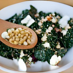 the fried swiss chard with cheese is transferred to a serving plate.