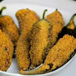a plate of breaded-stuffed jalapeno peppers that have been set aside for 10 minutes.