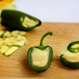 the jalapeno peppers are filled with the cheese mixture.