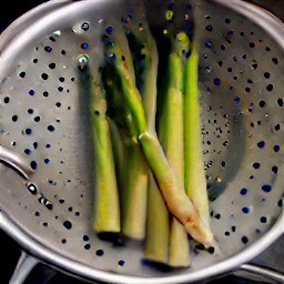 asparagus that has been rinsed and drained in a colander.