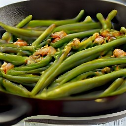 a pan of green beans cooked with shallots, red wine vinegar, salt, and black pepper.