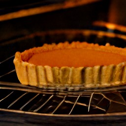 the pie tin is in the oven.