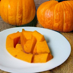 the pumpkin flesh is transferred to a plate.