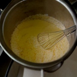 a bowl of dough made from white cake mix, rice krispies, melted butter, beaten eggs, and maple syrup.