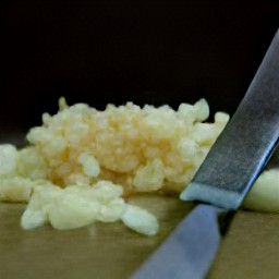 garlic that is peeled and minced, as well as chopped rosemary.