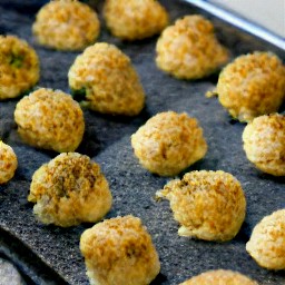 a baking sheet with dough balls that have been cooked for 30 minutes.