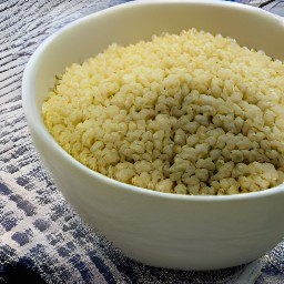 a bowl of hot water with bulgur, covered with a tea towel, set aside for 20 minutes.