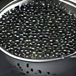 a can of black beans that have been drained in a colander.