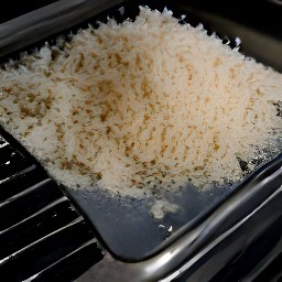 a toaster tray full of grated coconuts.