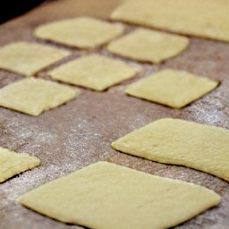 cut rolled out puff pastry into 16 squares.