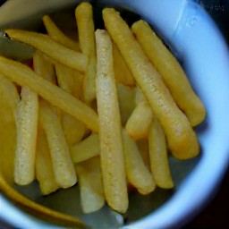 there a bowl of russet potato sticks with olive oil mixed in.