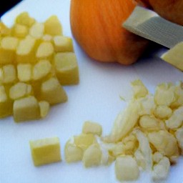 3/4-inch cubes of potato, pumpkin, and sweet potato, as well as small pieces of onion and garlic.