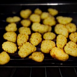 the oven is turned off and the baking sheet is removed.