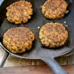 the patties are flipped over with a spoon.