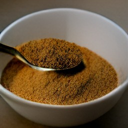 a bowl containing cinnamon and granulated sugar combined together.