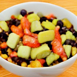 a bowl of red wine vinegar, olive oil, spicy sauce, and crushed garlic mixed together for 2 minutes. then avocado cubes, drained sweet corn, drained black beans, diced tomatoes, onions and cilantro are