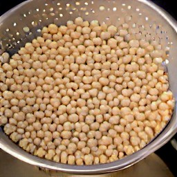 the chickpeas are drained in a colander.