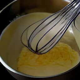 the output is a bowl of whisked eggs with sour cream and monterrey jack cheese.