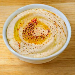 a bowl of pasta with paprika on top.