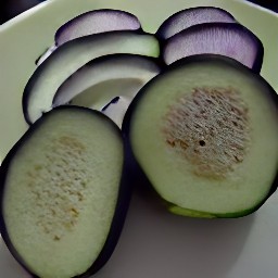 an eggplant that has been destalked and sliced.