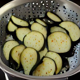 the eggplants are rinsed and drained in the colander.
