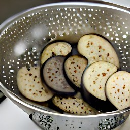 the salt will draw out the water from the eggplant slices.