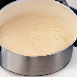 the cake batter is poured into a baking dish.