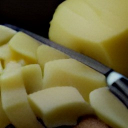 chopped potatoes and cilantro, then peeled garlic cloves.