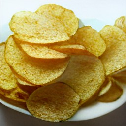 the microwave potato chips are transferred to a plate.